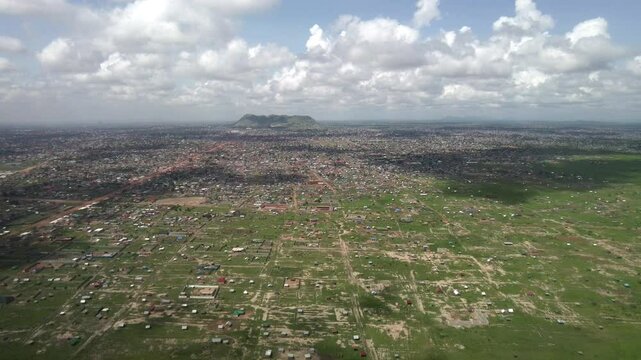 High aerial flyover of Juba, the capital of South Sudan, taken from an airplane.