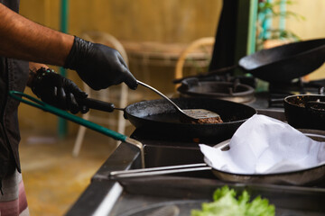 Chef Perfectly Grilling Fresh Beef Patties for the Ultimate Burger