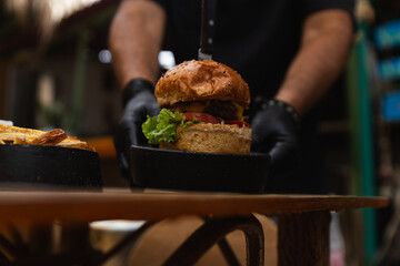 Chef Presenting a Delicious Burger