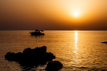 fishing boat at sunset