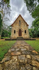Obraz premium Stone Chapel Stands Amidst Lush Green Tropical Foliage