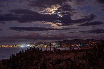 sunset over the sea and city