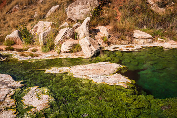 Beautiful, colorful mineral pools wind their way at Hot Springs State Park, home to the world's largest mineral hot springs.
