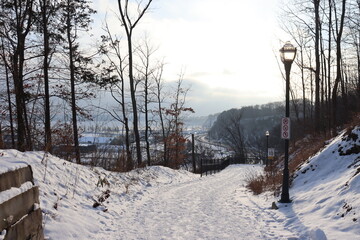 Hiking trail in a park and a view of the Champlain boulevard in Quebec city. A trail in december...