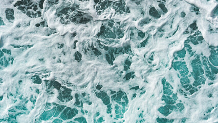 Foaming mixing ocean water blue deep colours close up background texture
