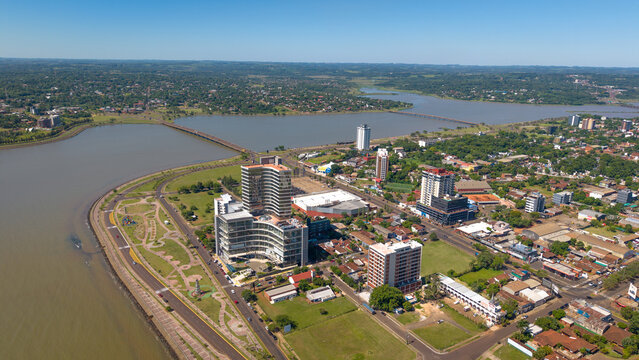 Aerial view of Encarnaci&oacute;n, Paraguay, showcasing the city's layout and its scenic surroundings, captured from a drone perspective.