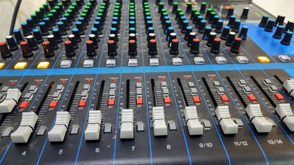 Mixing console close up. Sound mixer control panel. Audio equipment.