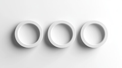 Fototapeta premium Three white circles on a white background.