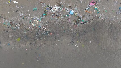 Pollution on the beach in Vietnam. Royalty high-quality free best stock of gabage, plastic, waste trash from the sea to make dirty beach. Waste that polluted the ocean environment, ecological prolem