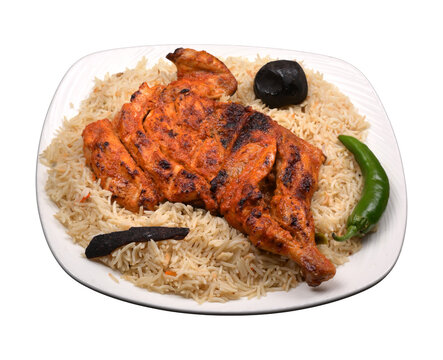 ALfahm fried chicken Mandi rice in a white ceramic plate
