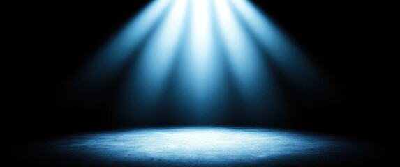 Blue spotlight illuminating a dark stage.
