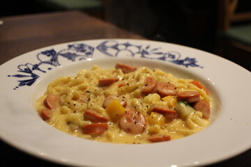 German cuisine: spätzle with cheese sauce and sausages