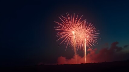 Fireworks exploding in the night sky with glowing embers and smoke trails