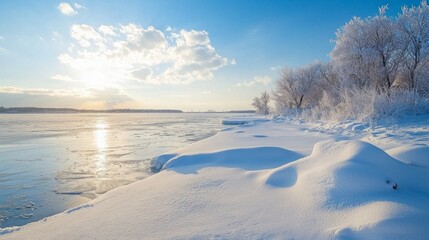 A snowy beach with a body of water in the background