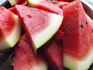 Red delicious fresh Watermelon pieces chopped and served for eating. Large edible fruit. The sweet,...