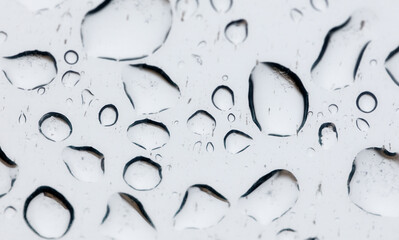 A white background with many small drops of water scattered across it