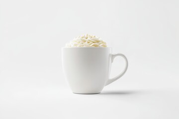Whipped cream in a white mug on white background.