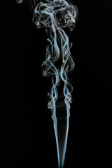 The smoke is thick and dark, creating a mood of mystery and danger