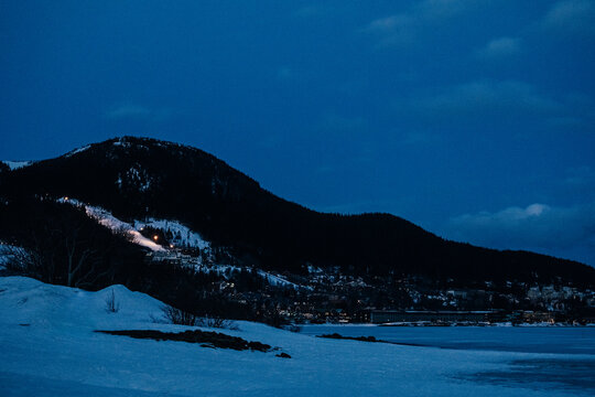 Blue Hour by Snowy Mountain Lake