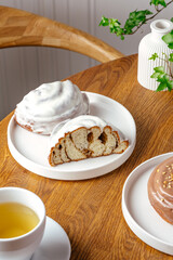 Cinnabon on a plate with tea