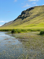 Scenic landscape with calm water and hills