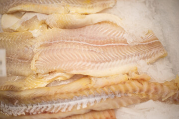 Frozen fish. Selling fish at the market. Fillet in the store.
