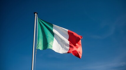 Italian Flag Waving Against a Clear Blue Sky on a Sunny Day