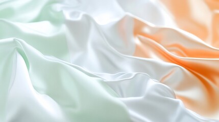 Obraz premium A close-up of flowing fabric in green, white, and orange hues.