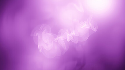 Purple smoke swirling creating abstract shapes and patterns with bright light