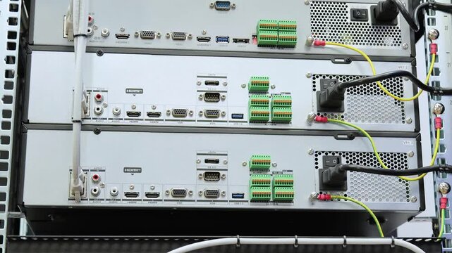 Telecommunication rack with Internet equipment, multimedia amplifiers, video surveillance system. Uninterruptible power supply. Soft focus. 