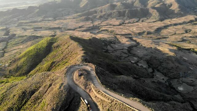 Car driving on Curvy dirth road in Ethiopia Mountains- Aerial footage
Drone voew over Car driving on Curvy dirth road in Ethiopia Mountains
