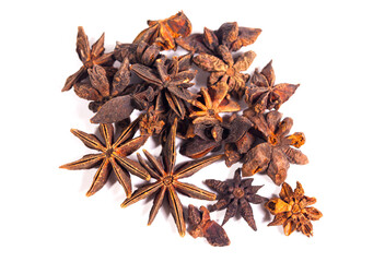 A bunch of dried up  star anise seeds are isolated on white background. Illicium verum (star anise) or badian is a medium-sized evergreen tree native to South China and northeast Vietnam.