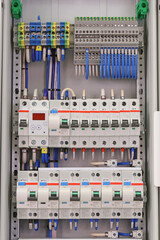 An electric switchboard for the organization of electricity supply to the apartment. Close-up. Soft focus.