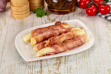 Hot mozzarella sticks with bacon