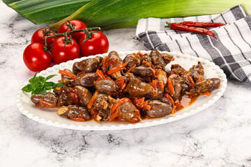 Baked chicken hearts with vegetables