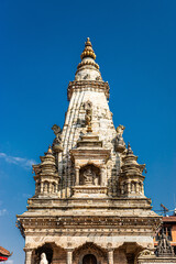 Fototapeta premium Upper part of the stone carved Vatsala Durga temple on the Bhaktapur Durbar square. Kathmandu valley, Nepal.