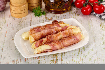 Hot mozzarella sticks with bacon