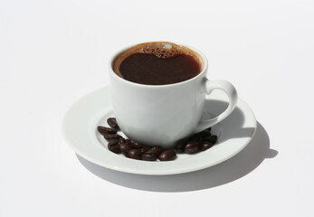 Cup of Turkish Coffee with Coffee Beans isolated on white