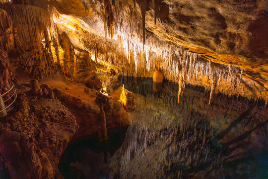 Stalactites reflecting on underground lake in caves of drach