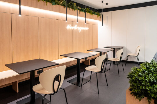 Modern airport workspace offering comfortable seating and tables for business travelers