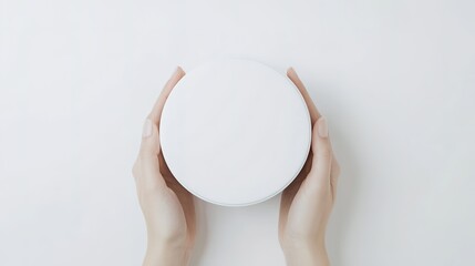 top-down view of minimalist moisturizing cream jar with blank white label its clean lines resting on flawless white