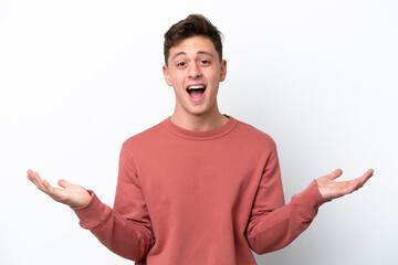 Young handsome Brazilian man isolated on white background with shocked facial expression