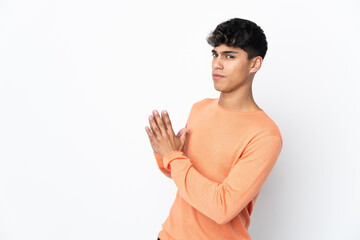 Young man over isolated white background scheming something