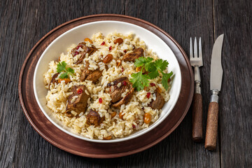 beef and rice in white bowl, top view