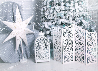 Christmas decorations in snow, xmas tree, star and light
