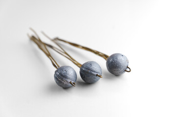 Old lead fishing sinkers on a white background. fishing tools.