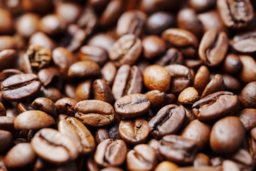 beans of roasted natural coffee. coffee background and texture. Aromatic invigorating drink.