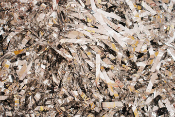 ribbons of metal foil or tinsel. background and texture. Festive atmosphere.
