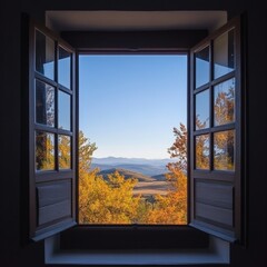 Fototapeta premium A stunning autumn view from an open window, showcasing vibrant foliage and distant mountains.