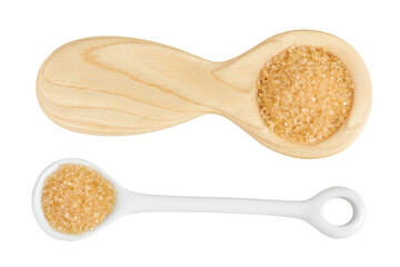 The brown sugar in ceramic and wooden spoon isolated on white background. Top view. Flat lay